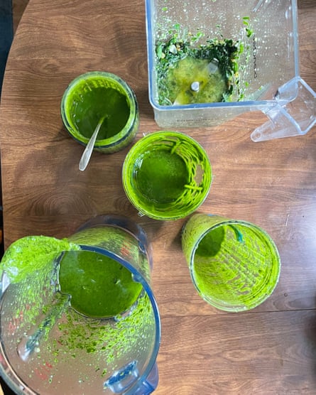 blender from above with green juice in it