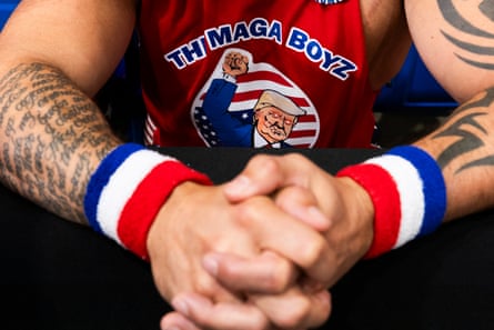 close up of a man wearing a tank top that reads ‘the maga boyz’