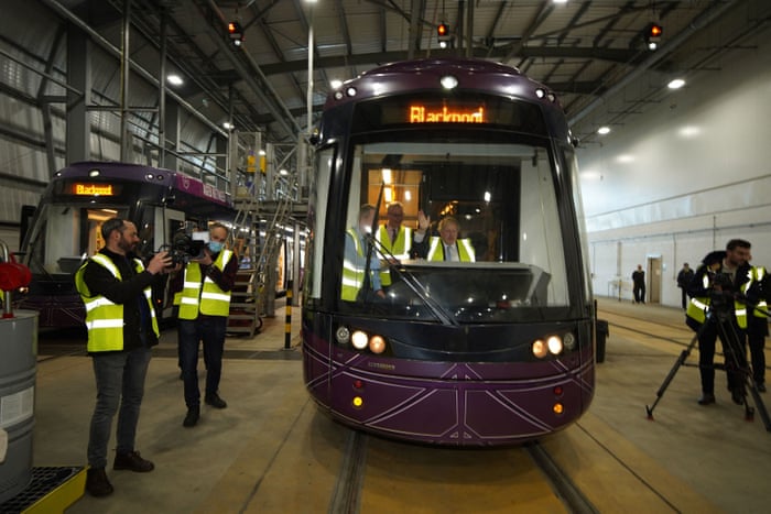 Boris Johnson posing for photographs in the cab of a tram during a visit the Blackpool Transport Depot today.