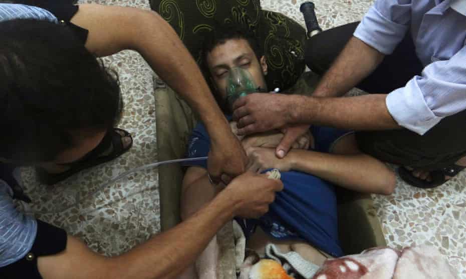 A man being treated after what activists claimed  was a nerve gas attack in the Damascus suburbs of Jesreen in August 2013