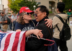 Supporters of Republican presidential candidate and former US president Donald Trump comfort each other after the guilty verdict.