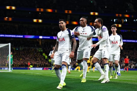 Cristian Romero of Tottenham Hotspur celebrates with teammates after scoring their side’s first goal to make it 1-0 against Borussia Dortmund.