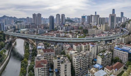 A high bridge over a group of tall residential buildings.