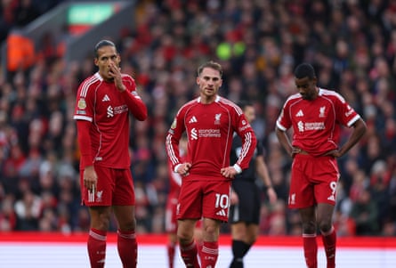 Virgil van Dijk, Alexis Mac Allister and Alexander Isak look dejected
