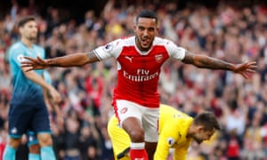 Arsenal’s Theo Walcott celebrates after scoring against Swansea.