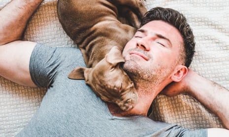 Man and charming puppy resting