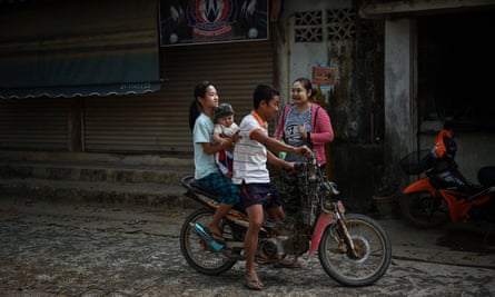 Karen migrants on a bike in Thailand