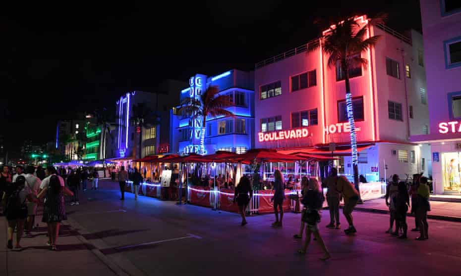 The city of Miami Beach has resorted to handing out masks to visitors to encourage face covering.