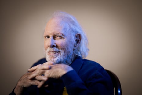 Actor Bruce Dern smiles, hands clasped, wearing a dark jacket