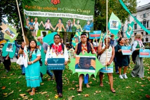 Members of a delegation of indigenous and rural community leaders from 14 countries in Latin America and Indonesia, the Guardians of the Forest campaign, demonstrate against deforestation in London.