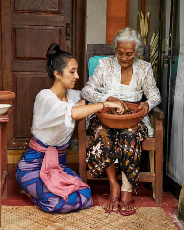 Maya Kerthyasa preparing ingredients with her niang in Bali