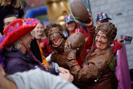 Street performers dressed in fake mud entertain fans outside the stadium before the Women’s Rugby World Cup 2025 semi-final match between England and France.