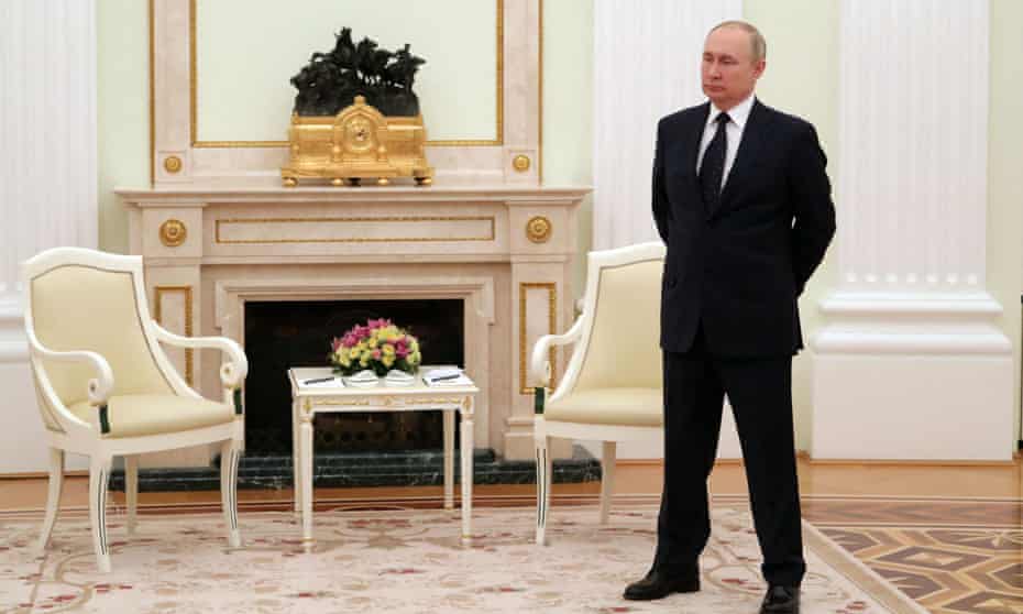 Vladimir Putin in the Kremlin as he waits for Belarus president Alexander Lukashenko, 11 March.