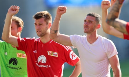 Robin Gosens (right) celebrates with the away fans at full-time in Darmstadt.