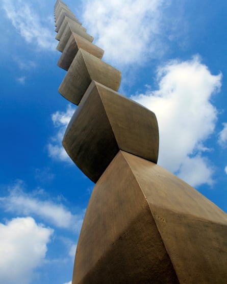 The Endless Column comprises a cast-iron sculpture by Constantin Brâncuși, formed of bronze-coloured diamond shapes stacked on top of each one another that reach far into the clouds of a blue sky