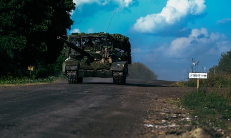 Ukrainian soldiers on a road near the border with Russia