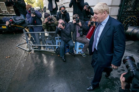Boris Johnson runs the gauntlet of photographers after a meeting at the Foreign Office