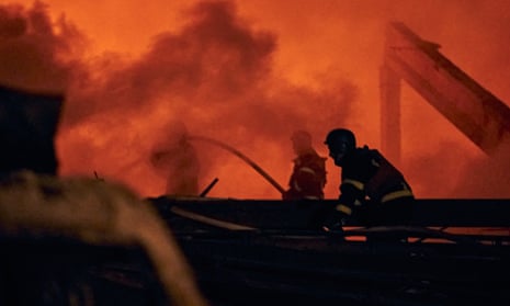 Ukrainian State Emergency Service firefighters work after a rocket attack in Kramatorsk, eastern Ukraine.