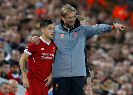 Liverpool manager Juergen Klopp gives instructions to substitute Philippe Coutinho as he waits to come on.