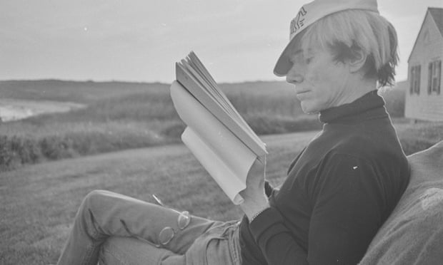 Warhol sitting in rural surroundings, reading, in The Andy Warhol Diaries.