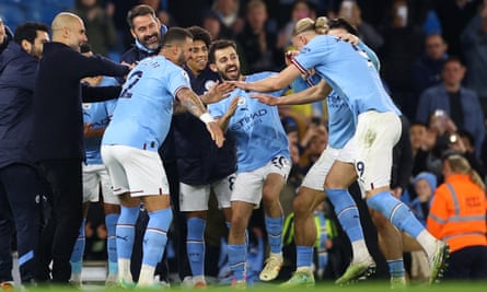 Manchester City’s Erling Haaland receives a guard of honour from teammates and manager Pep Guardiola at the end of the match after breaking the record for most goals scored in a single Premier League season.