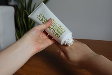 The writer is applying Malin & Goetz body cream