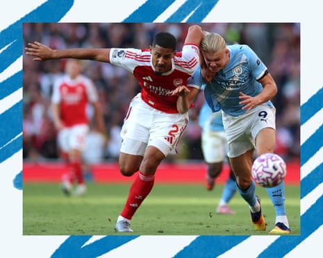 Manchester City's Erling Haaland tussles with Arsenal's William Saliba
