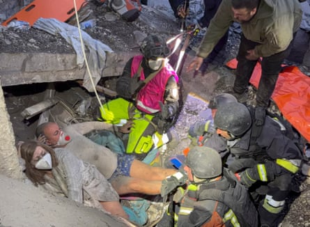 Rescuers free people trapped under rubble at the site of a Russian attack on a residential area in Zaporizhzhia.