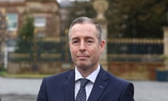 Head and shoulders shot of Paul Givan in suit and tie