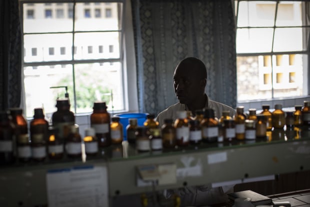 Biochemist Denys Rukarata tests locally produced oral liquid morphine for purity at the Pharmaceutical Laboratory of Rwanda.