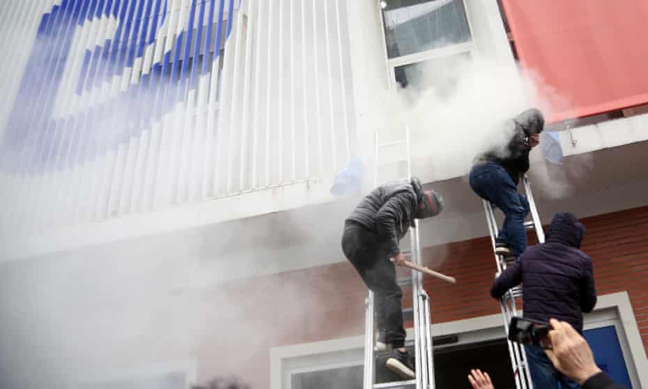 Protesters storm Albania's Democratic Party office in Tirana.