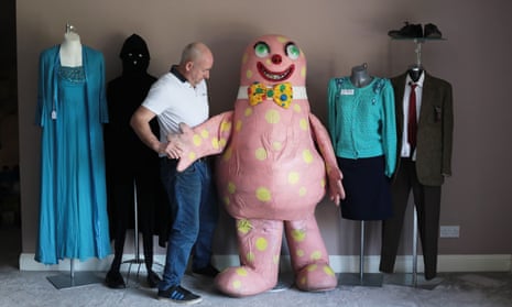 Scott, with items from his memorabilia collection. From left: a dress that belonged to Dame Vera Lynn, the Phantom Flan Flinger outfit from Tiswas, an original Mr Blobby suit, Angie Watts’ outfit from EastEnders and Mr Bean’s suit. 