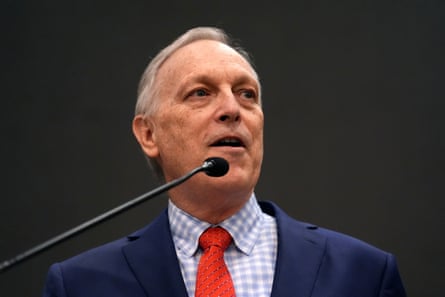 A man in front of a microphone