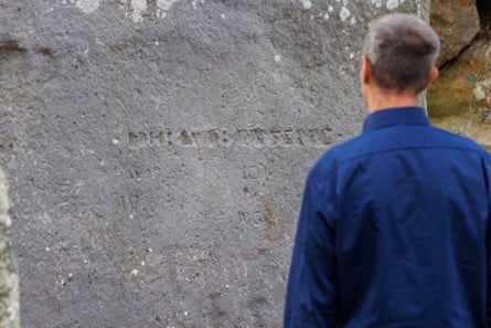 Steven Morris examines an inscription