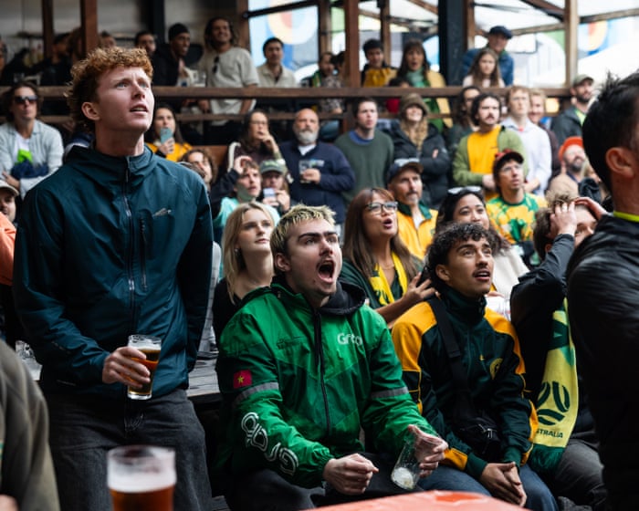 Packed pubs and skiving school: Australian fans nurse pints over laptops to cheer on Socceroos