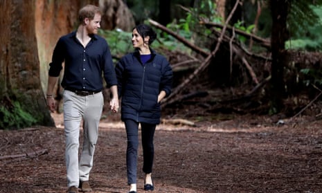Britain’s Prince Harry and Meghan, Duchess of Sussex walk through a Redwoods forest in Rotorua, New Zealand,