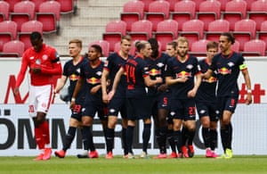 RB Leipzig’s Yussuf Poulsen celebrates scoring their second goal with teammates.