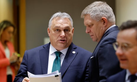Slovakia's prime minister Robert Fico, right, talks to Hungary's prime minister Viktor Orbán, middle, during a round table meeting at an EU summit in Brussels last year.