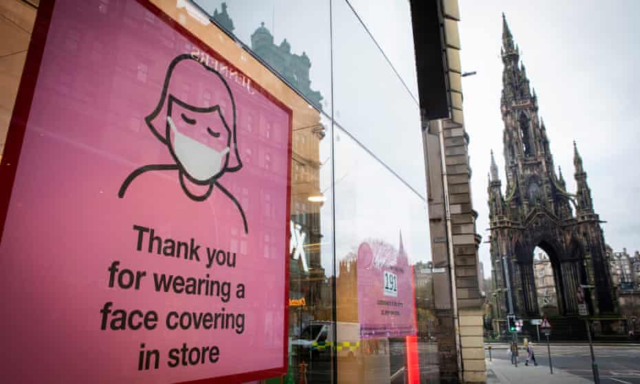 A Covid sign in a shop in Edinburgh city centre.