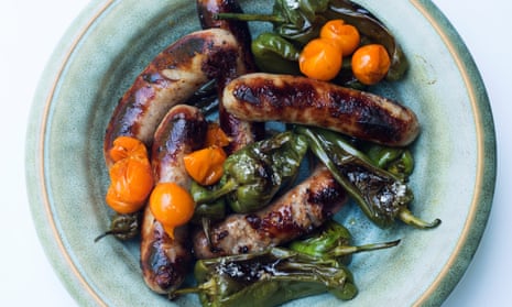 Sausages with padron peppers on a plate