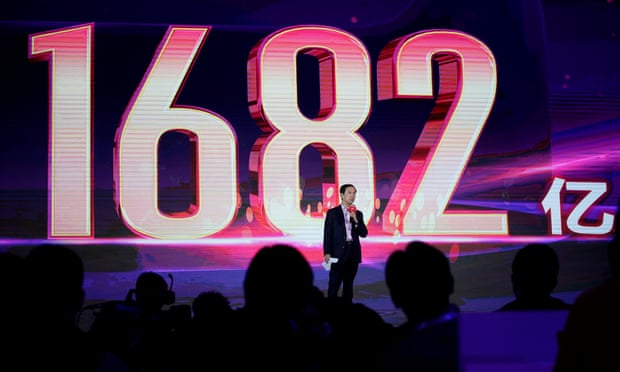 Daniel Zhang, chief executive officer of Alibaba, at the group’s singles day festival in Shanghai with the yuan spending total of 168.2bn shown on the screen.