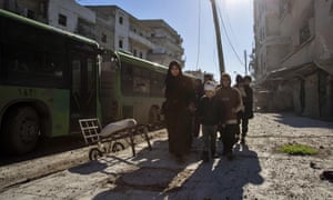 Syrians evacuate Aleppo in December 2016.