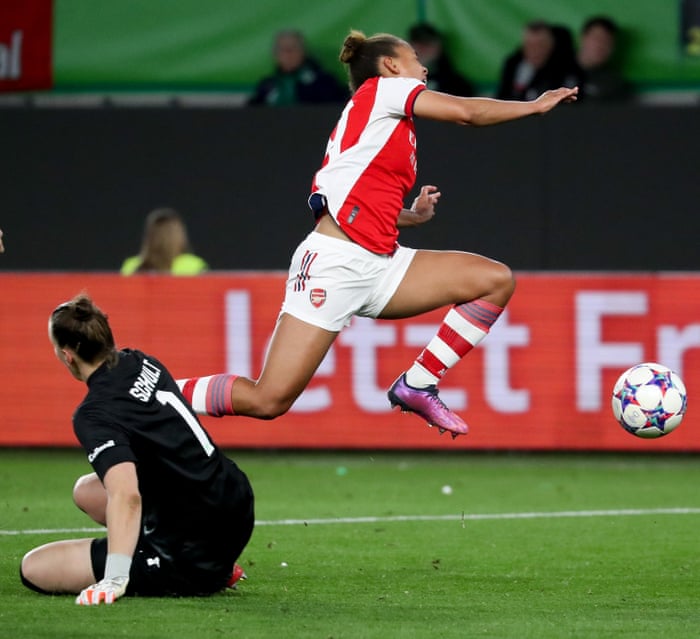 Arsenal’s Nikita Parris takes a tumble after a challenge by Wolfsburg’s goalkeeper Almuth Schult.