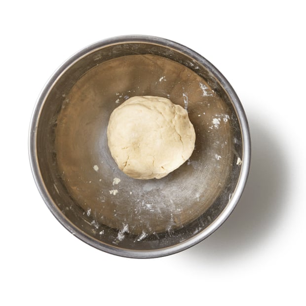 Add the milk, then bring the mix together into a ball of dough, being careful not to overwork it.