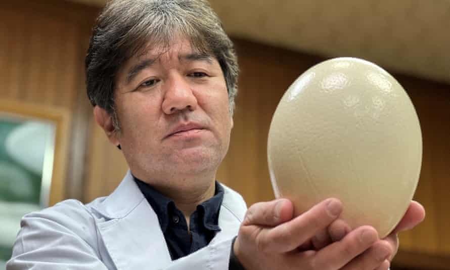Yasuhiro Tsukamoto holding an ostrich egg.