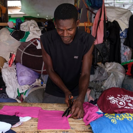 John Poku Agyemang, an upcycler works in his shop at Kantamanto market in Accra, Ghana
