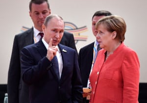Merkel rolls her eyes while talking with Vladimir Putin at the start of the G20 Hamburg summit in 2017