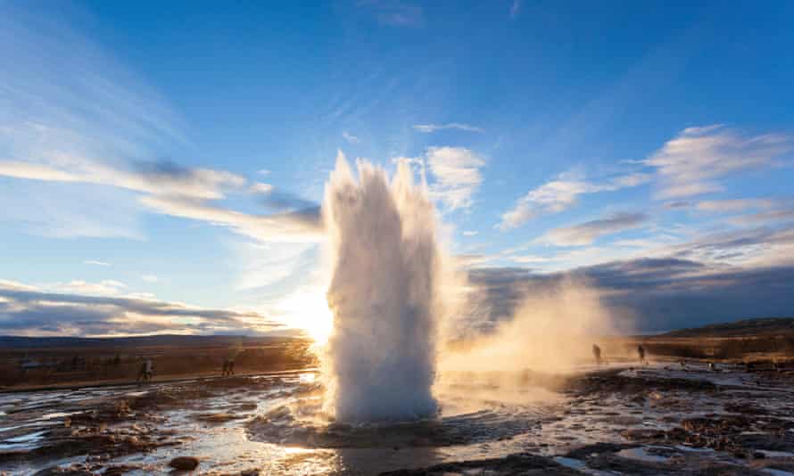 Strokkur Geyser, a shoot of water rising upwards out of the ground. Iceland.