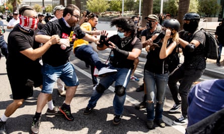 Anti-vaccination demonstrators, left, and counter protesters clash during an anti-vaccination protest in Los Angeles in August 2021.