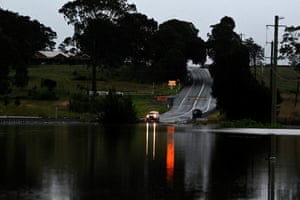 A flooded road at dusk